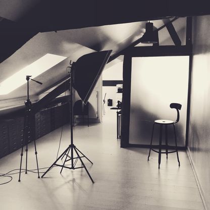 A photo studio under the eaves, in black and white.